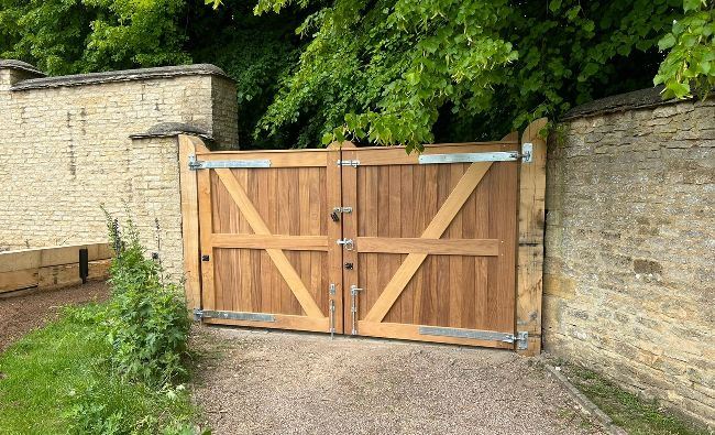 Rear view of a set of iroko hardwood gates in Burford, Oxfordshire